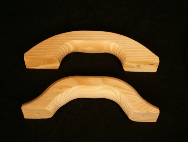 Two wooden float handles in a natural finish